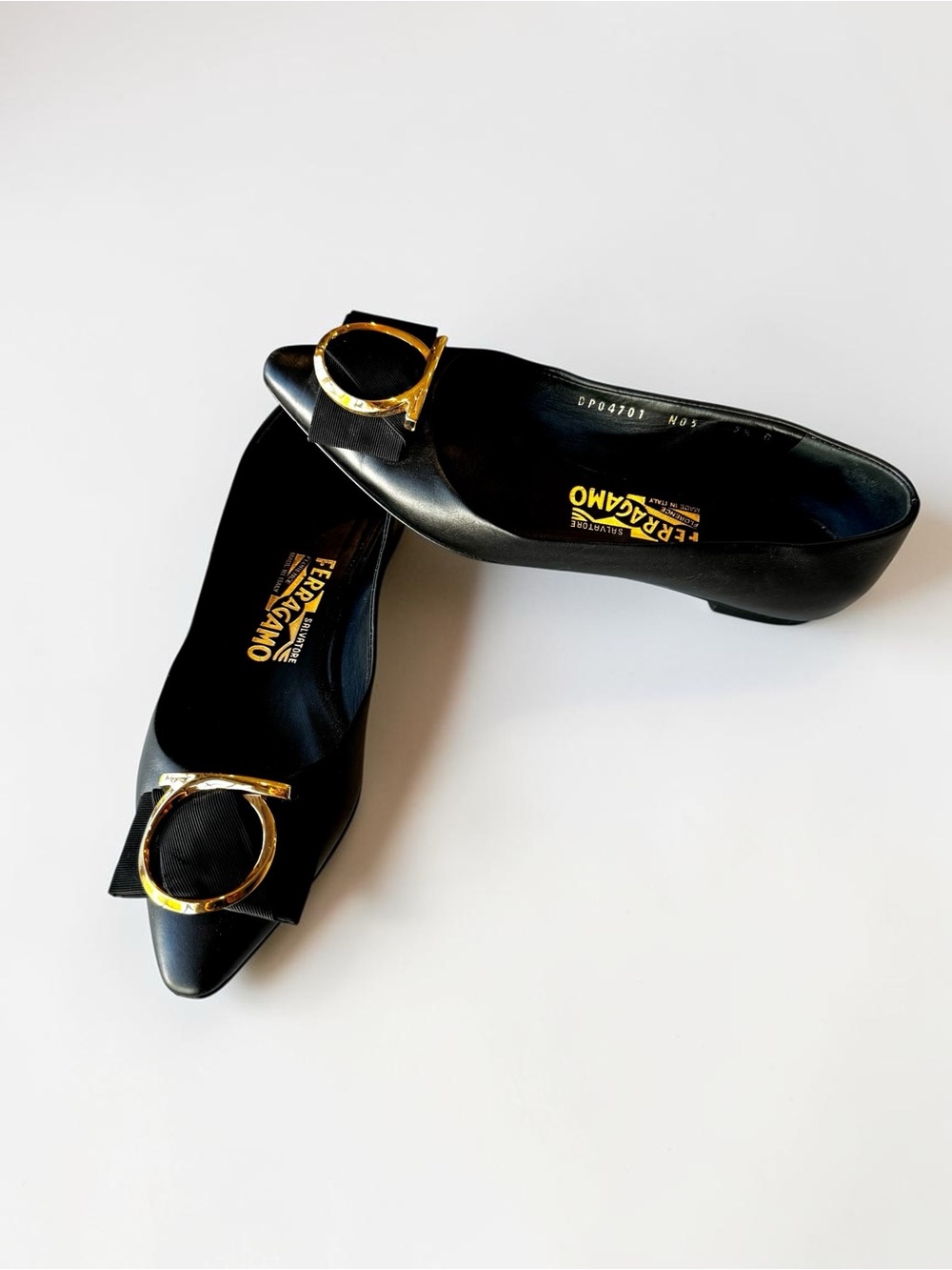 SALVATORE FERRAGAMO black leather Ezia Ballet Flats with gold logo hardware
